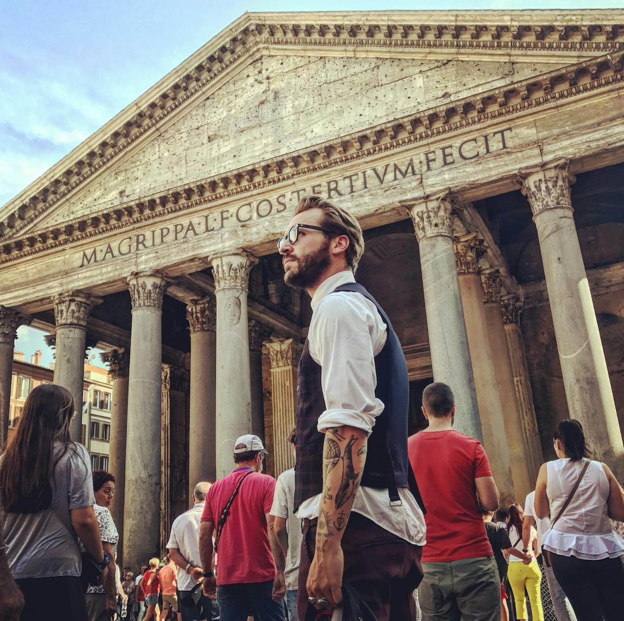 Visitors at the Pantheon in Rome, captured during the day highlighting Roman architecture.